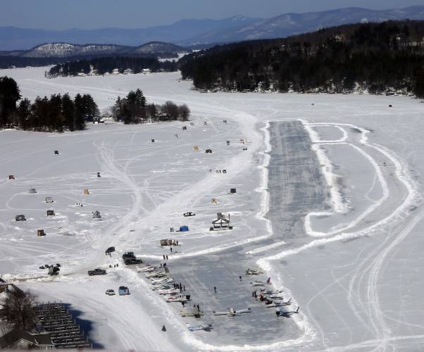 Planes are parked after flying in on frozen Lake Winnipesaukee on Saturday, Feb. 28, 2015, in Alton. 