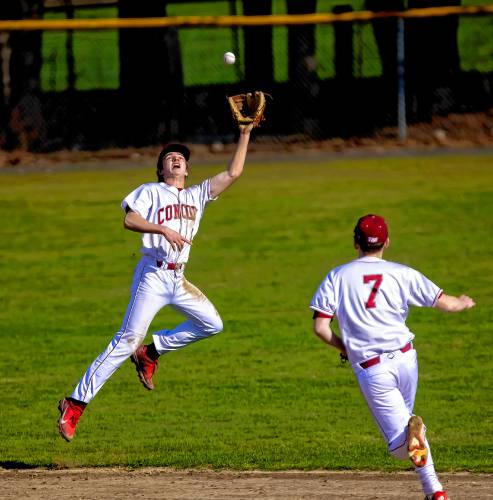 Concord shortstop Alex Turant makes a leaping catch on the edge of shallow centerfield against Manchester Central-West on Monday afternoon. Concord lost in extra innings, 15-10.