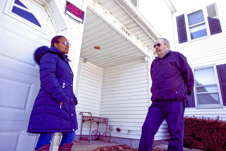 Brenda Masweic Adams, Manchester’s tax collector, along with Robert Gagne, the city’s chairman of the board of assessors, at a house in Manchester that is being sold for back taxes.