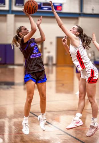 Concord Christian forward Emma Smith goes up against 6â1 forward Melody McCarthy during the second half at Exeter High School on Monday, March 10, 2025. Concord lost to the undefeated Bedford.