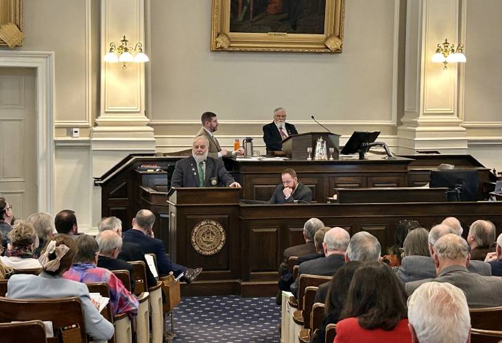 Rep. Dan McGuire, a Republican from Epsom, defends his party's budget cuts on the House floor during Thursday's vote on the next state budget. Rep. Dan McGuire, a Republican from Epsom, defends his party's budget cuts on the House floor during Thursday's vote on the next state budget.