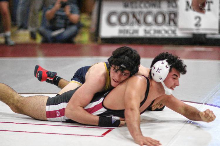 Bow’s Ben McDowell (top) attempts to pin Concord’s Jeydon Wilson during a 152-pound consolation match at the Capital City Classic wrestling tournament at Concord High School on Jan. 28. Both athletes are back representing their schools this season.