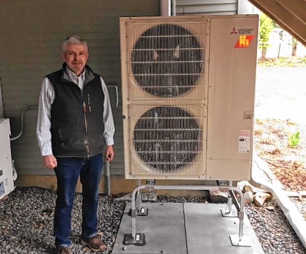 Tim Riley is a Peterborough resident who installed a heat pump with help from the PREP team during a pilot program. He and his wife installed the heat pump because they wanted to do what they could as individuals to mitigate climate change. But the system has additional benefits, he said. “We love the system,” he said. “It’s so quiet.” Tim Riley is a Peterborough resident who installed a heat pump with help from the PREP team during a pilot program. He and his wife installed the heat pump because they wanted to do what they could as individuals to mitigate climate change. But the system has additional benefits, he said. “We love the system,” he said. “It’s so quiet.”