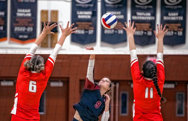 Concord’s Brooke Wyatt spikes the ball against Pinkerton Academy on Monday evening.