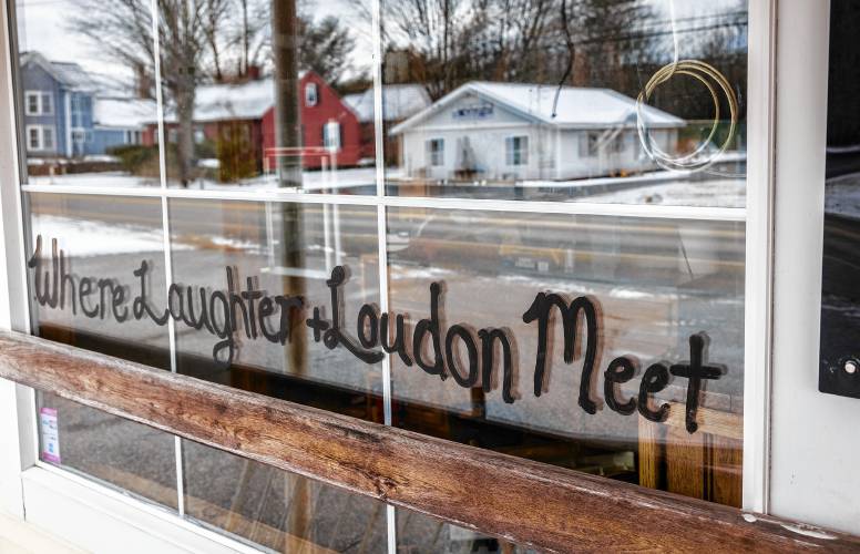 A sign on the windows of the Loudon Village Country Store.