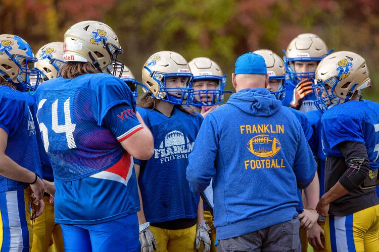 Franklin head football coach Tim Snow talks with the team during practice at the high school on Tuesday, October 24, 2023.