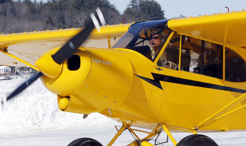 Angela Leedy of Pittstown, N.J., looks for a parking spot after flying three hours to the only ice runway in the Lower 48 states approved by the Federal Aviation Administration on Saturday, Feb. 28, 2015, on Lake Winnipesaukee in Alton, N.H. 