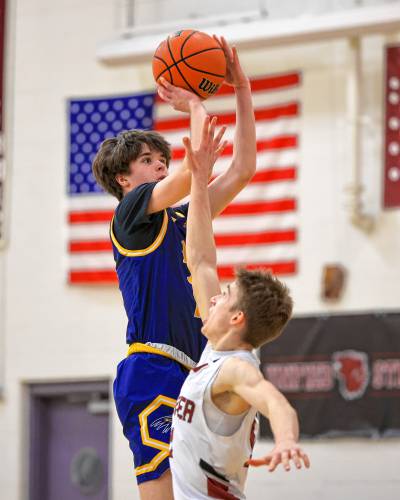 Bow's Brendan O'Keeffe (left) shoots over a Hanover defender during a Division II boys' basketball quarterfinal on Friday, March 1, 2024 at Hanover High School. O'Keeffe scored 23 of his team's 34 points in a 51-34 loss.