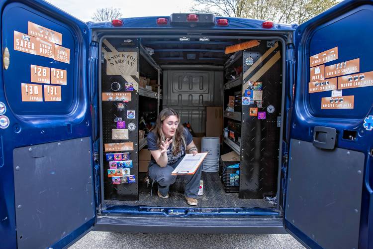Director of Education and Technical Assistance for the NHHRC goes over the checklist for items needed in the van the organization has to bring out to the public when needed.