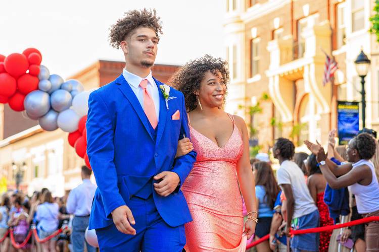 Crowds of onlookers applaud as Wayne Sakakeeny and Lillian Williams walk by on their way to Concord’s prom.