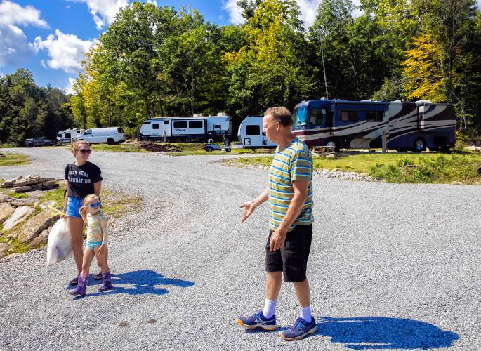 Kevin McCauley talks with RV owner Samanth Krulick who is travelling around the country with her family. When McCauley bought his 500 acres of land in 1978, it was little more than a dirt path over a brook and plenty of trees, is now the Rocky Valley RV Resort.
