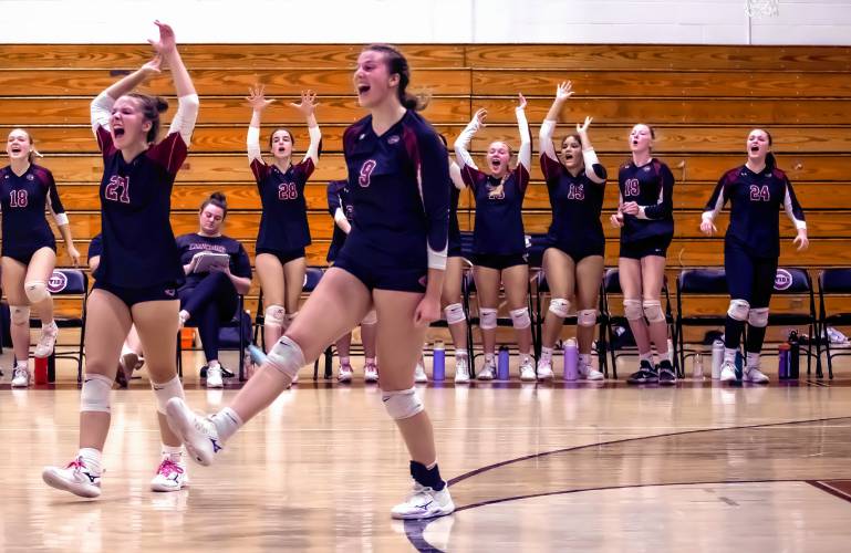 The entire Concord team, including the bench, celebrates a point.