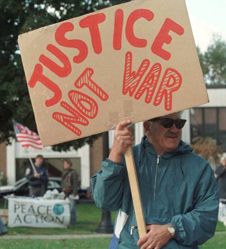 Ken Reichstein of Sanbornton holds up a sign calling for methods other than war to be used by the U.S. in dealing with terrorism during a peace rally in front of the State House Monday, Oct. 8, 2001, in Concord. Ken Reichstein of Sanbornton holds up a sign calling for methods other than war to be used by the U.S. in dealing with terrorism during a peace rally in front of the State House Monday, Oct. 8, 2001, in Concord.