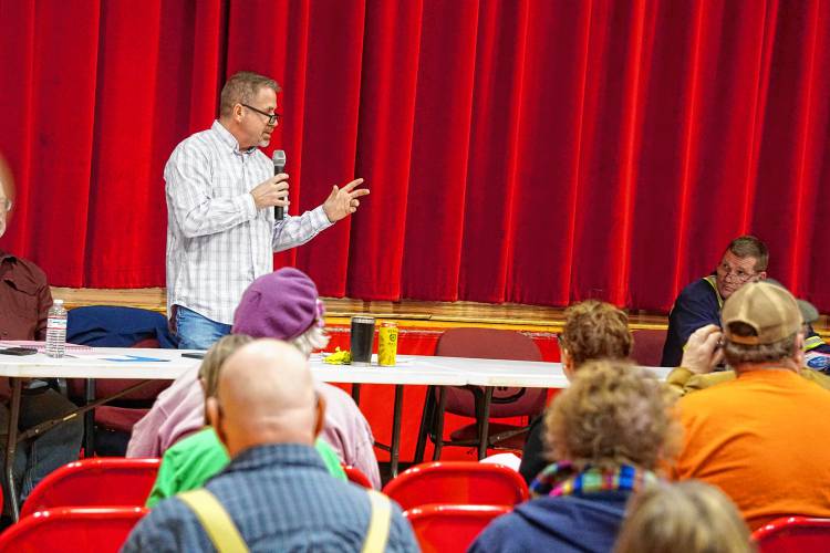 Town Selectman Richard Bouchard addresses voters. 