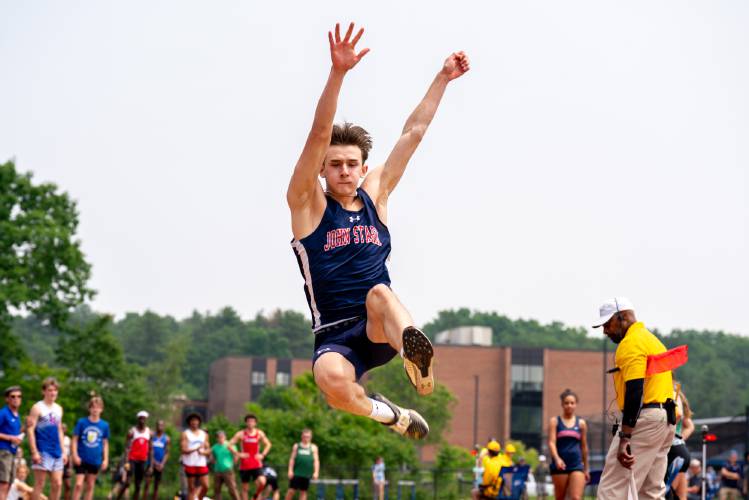 John Stark’s Rio Calle competes in the long jump at the Meet of Champions on Sunday at Oyster River High School. Calle leapt 23 feet, 7.25 inches to set a new state record. 