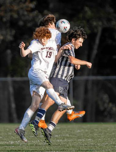 Merrimack Valley midfielder Andrew Surprenant battles Plymouth defenders Landon Custance (19) and Turner Oldenburg as they all go up for a header during the second half on Tuesday, October 24, 2023.
