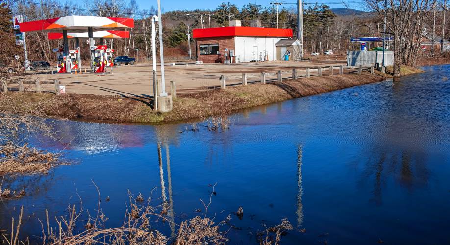 Flood waters surround the Big Apple Citgo gas station on Holderness Road in Plymouth on Wednesday, December 20, 2023. The station was closed after the store was flooded from the Monday storm.