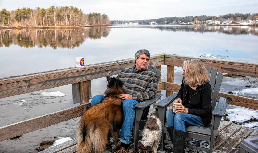 Dennis Pratt and his wife, Carol, enjoy their morning coffee on the deck of their condo near Dover Point in Dover on Thursday, February 1, 2024.