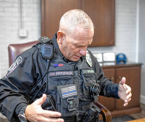 Pittsfield police officer Don Bolduc shows his vest at the the station before going on patrol on Thursday, February 8, 2024.