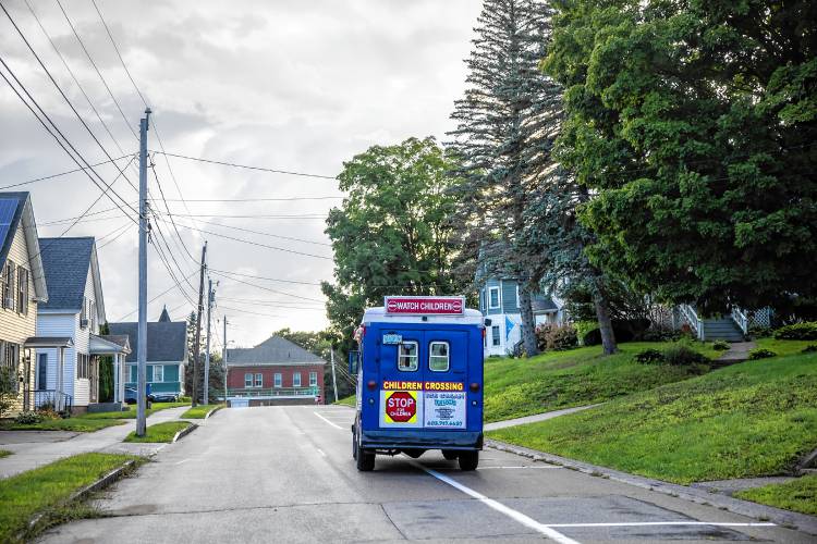 Adam Gelinas drives their van around in the neighborhood near where they live in Allenstown on Thursday evening, August 22, 2024. The whole family was there to help sell ice cream to the area.