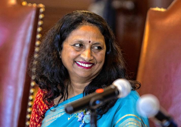 Elector Latha Mangipudi smiles during the ceremony to cast ballots on behalf of Vice President Kamala Harris and Minnesota Gov. Tim Walz, the Democratic vice presidential nominee, in a ceremonial vote at the Executive Council chamber.