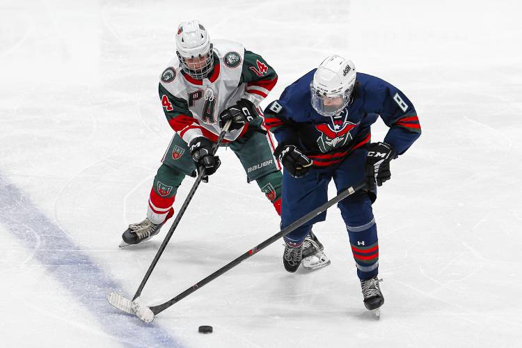 John Stark-Hopkinton/Hillsboro-Deering's Kip Hedquist (8) battles for possession of the puck with Pembroke-Campbell's Thomas Hanson (14) during a game at Everett Arena on Wednesday. Hedquist recorded a hat trick in the first period to lift the General Hawks to a 7-1 victory. John Stark-Hopkinton/Hillsboro-Deering's Kip Hedquist (8) battles for possession of the puck with Pembroke-Campbell's Thomas Hanson (14) during a game at Everett Arena on Wednesday. Hedquist recorded a hat trick in the first period to lift the General Hawks to a 7-1 victory.