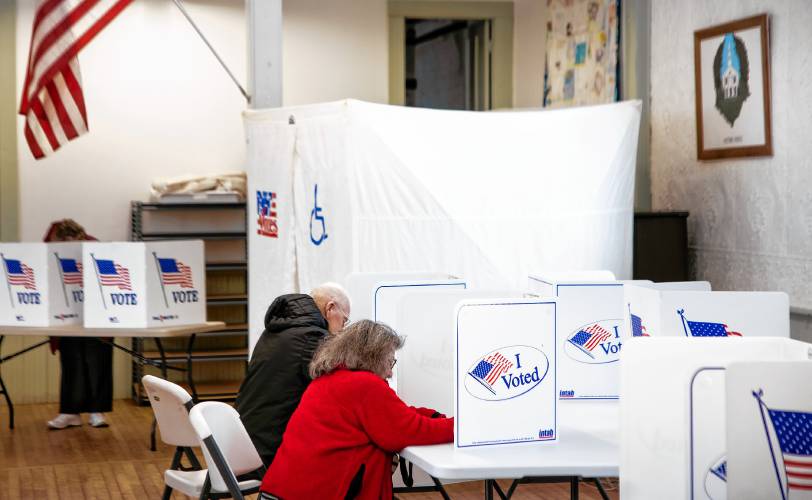Gail Henry votes inside the Salisbury Town Hall on Tuesday, March 11, 2025.