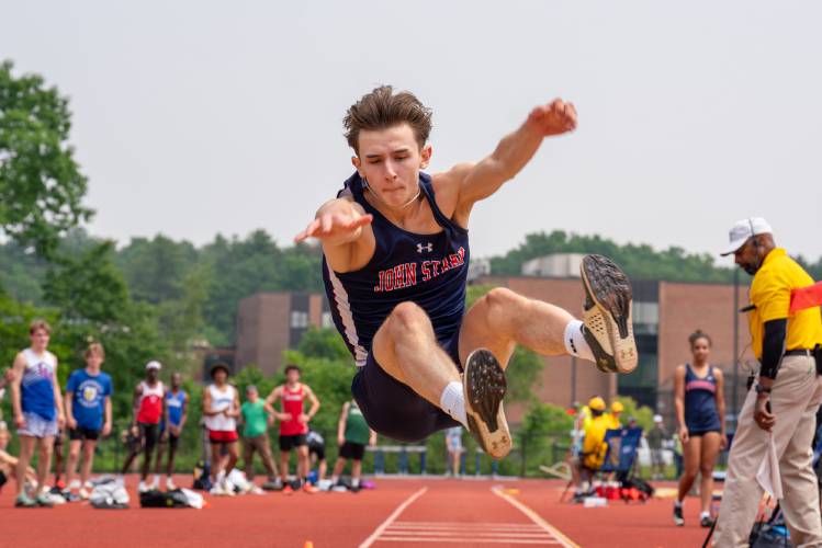 John Stark’s Rio Calle competes in the long jump at the Meet of Champions on Sunday at Oyster River High School. Calle leapt 23 feet, 7.25 inches to set a new state record. 