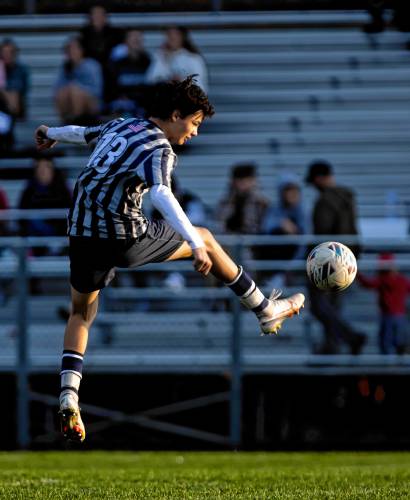 Merrimack Valley defenseman Jonas Weed leaps to kick the ball away during the second half on Tuesday, October 24, 2023.