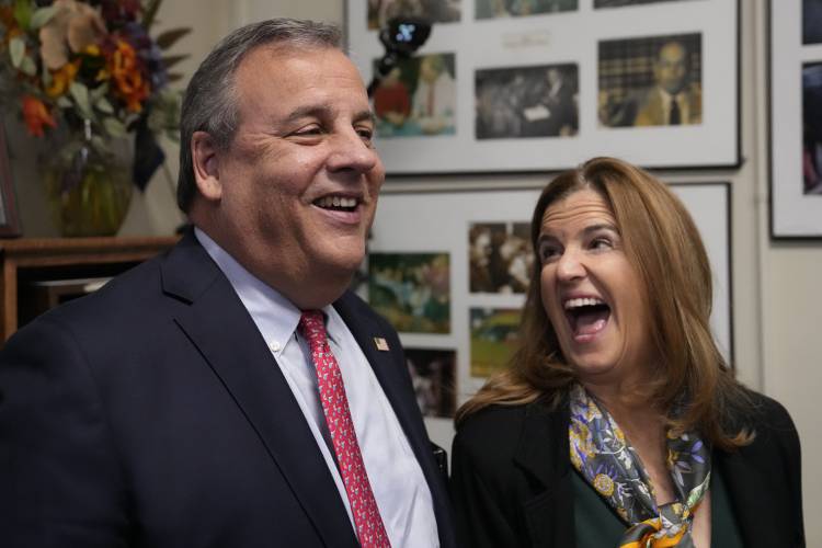 Republican presidential candidate and former New Jersey Gov. Chris Christie, left, laughs with his wife Mary Pat while filing paperwork to be on the Presidential Primary ballot at the State House, Thursday, Oct. 19, 2023, in Concord, N.H. (AP Photo/Charles Krupa)