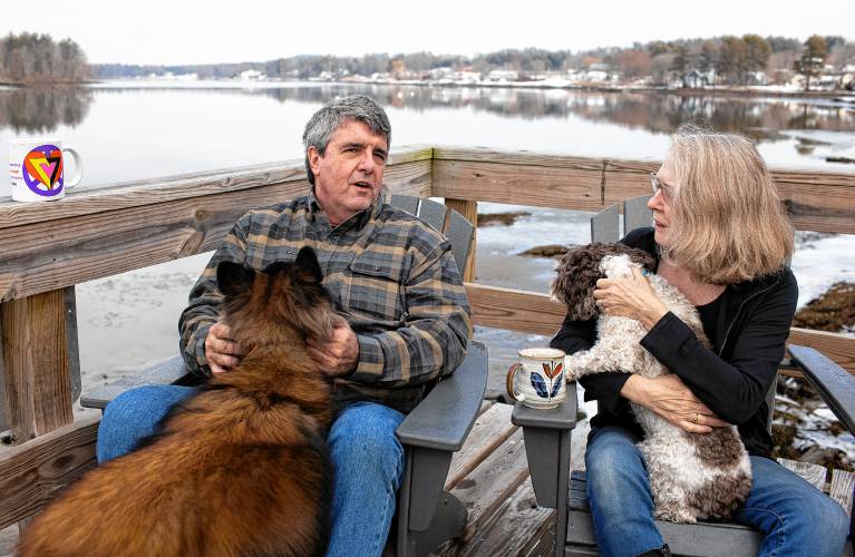 Dennis Pratt and his wife, Carol, enjoy their morning coffee on the deck of their condo near Dover Point in Dover on Thursday, February 1, 2024.