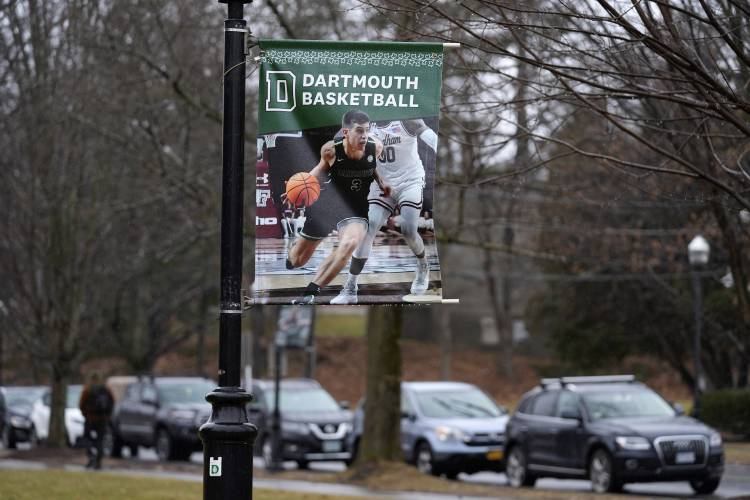 A poster of a basketball player is attached to a lamppost on the campus of Dartmouth College, Tuesday, March 5, 2024, in Hanover.