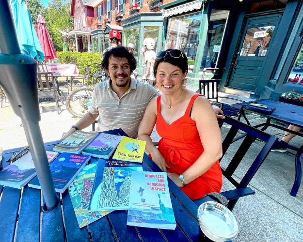 Christopher DiLoreto, left, and Zoë Wroten-Heintzmann of Monadnock Undergounsd display their published anthologies, magazines and novels. 