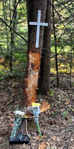 A cross and memorial have been placed at the site of a crash on Perry Pasture Road in Dublin, where a crash on Friday afternoon resulted in the death of Damien Cronan, 17, of Antrim, and the injury of two other teens.
