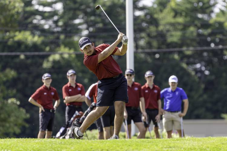 Concord’s Carl Sirrianna starts off the 2024 season with a drive off the first tee at Derryfield Country Club as his teammates watch on Aug. 28.