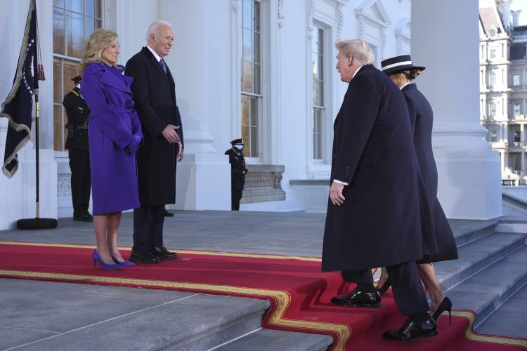 President Joe Biden, center left, and first lady Jill Biden, left, greet President-elect Donald Trump, center right, and Melania Trump, right, upon arriving at the White House on Monday.