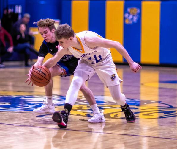 Concord Christian guard TJ Charbono (left) steals the ball from Franklin forward Harrison Kaplan during the second half on Tuesday night at the renovated Franklin gym. Concord Christian defeated Franklin, 64-50.