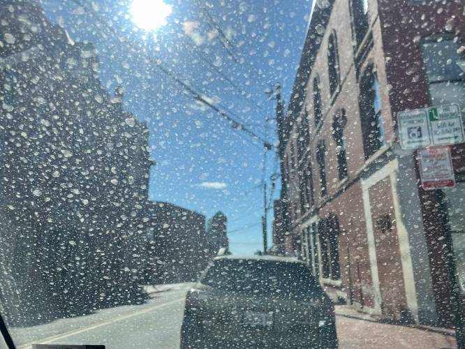 Dirt and dust originating 2,000 miles away in the desert Southwest, is seen on the windshield of a car in Portland, Maine, after being carried by wind and mixing with rain, Saturday, April 19, 2025. (Christian Bridges/WGME-TV via AP)