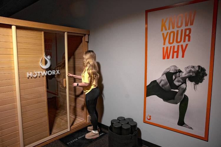 Co-owner Emily Lozada in one of the saunas at HotWorx on Loudon Road across the way from Buffalo Wild Wings. 