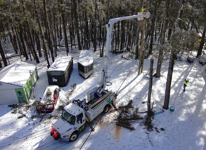 Crews from Eversource MA worked to restore power in Barrington following Saturday's storm.