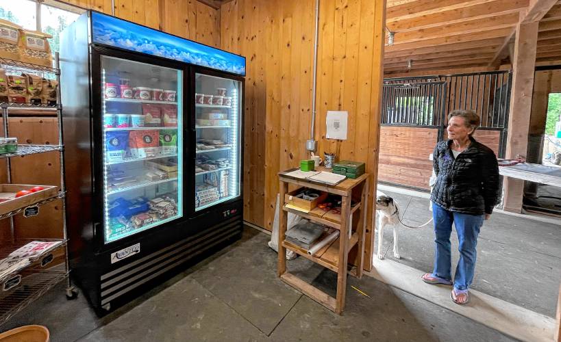 Sue Chollet and Rosie at the Nubanusit Farm store. 