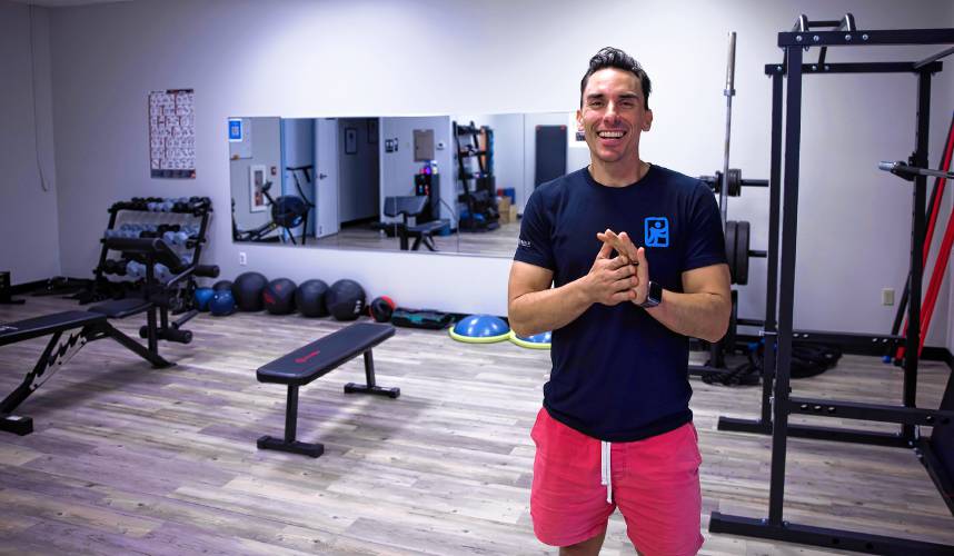 Owner Nate Lavallee at the Flexable Assisted Stretching and Wellness strength area at their new location on Sheep Davis Road in Concord.