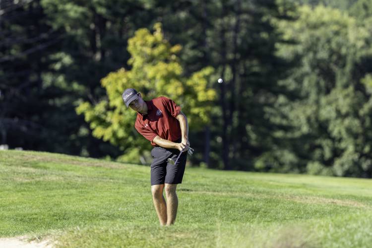 Concord’s Jaden Haas chips onto the green at Derryfield Country Club. Haas carded a 37 to earn medalist honors in the season-opening match on Aug. 28. 