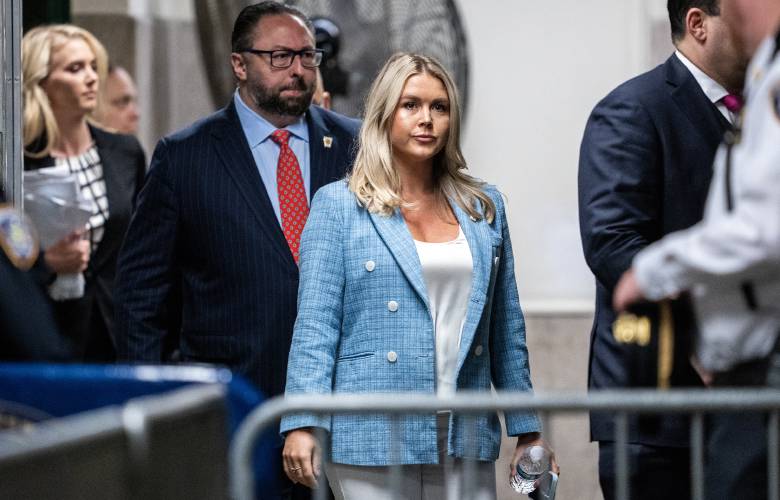 Trump campaign press secretary Karoline Leavitt, middle, and Trump adviser Jason Miller, left, arrive at the criminal trial of former President Donald Trump at Manhattan Criminal Court in New York on May 29, 2024. (Doug Mills/Pool/AFP/Getty Images/TNS)