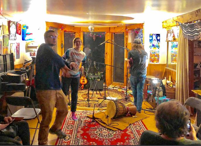 An house concert at Kate Schimke’s and Aaron Derman’s cabin in the Brookwood Community. 