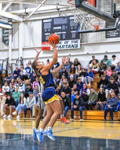 Bow’s Peyton Vaugh (22) goes up for a layup during the Capital Classic girls’ basketball championship game at Pembroke Academy on Monday. Vaughn scored a game-high 25 points to lead the Falcons to a 43-41 victory over Merrimack Valley.