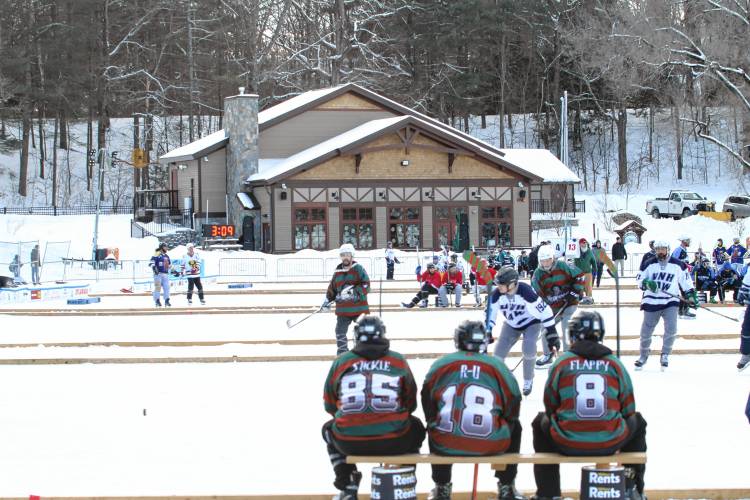 The Merrimack Lodge served as a backdrop for the pond hockey tournament held at White Park in Concord.