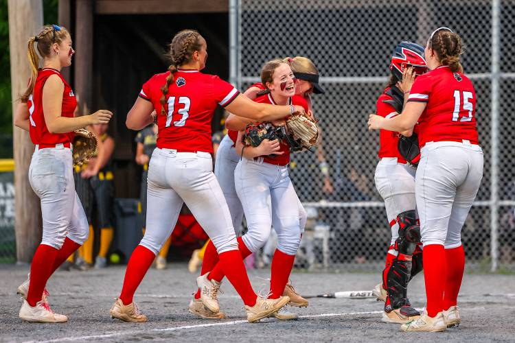 Coe-Brown celebrates around Kylie Bieniek after the then-sophomore pitched a no-hitter in the Division II softball semifinals at Plymouth State last June. Bieniek was voted Division II’s Player of the Year and is back to power the Bears this year.