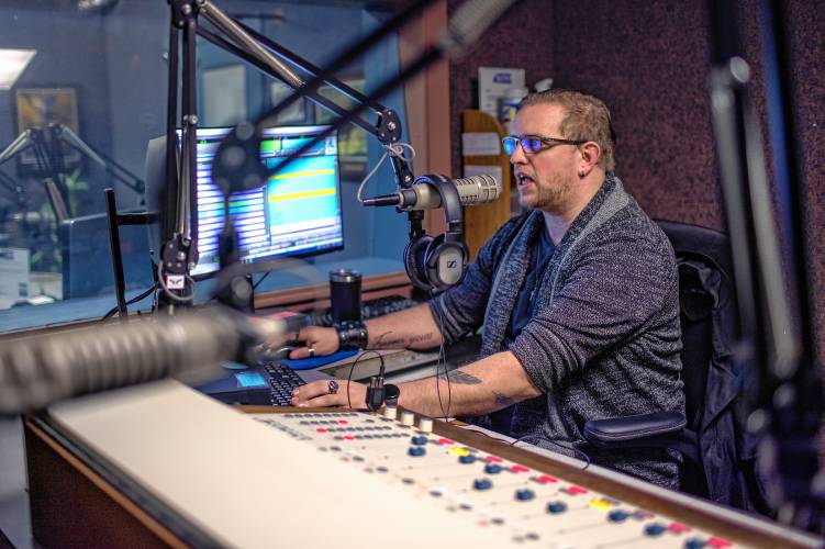 WKXL producer Andrew Gibson works the board at the Reddington Road studios in Concord on Wednesday.