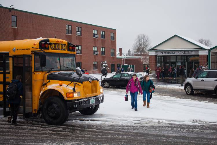 Students dismiss from Pembroke Academy in Pembroke as snow continues to fall on Tuesday, Dec. 12, 2017. Most capital-area schools closed on because of the storm, including the Concord district. (ELIZABETH FRANTZ / Monitor staff)